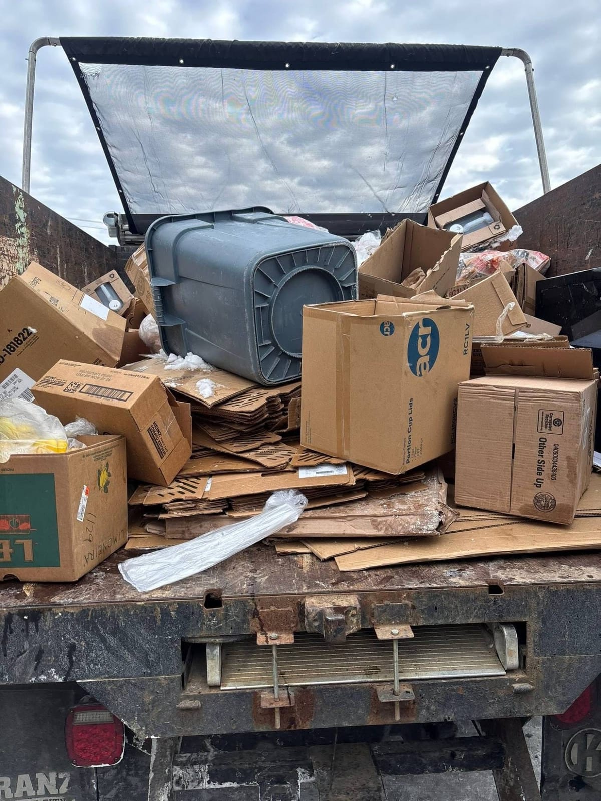 Truck bed loaded with boxes and cardboard