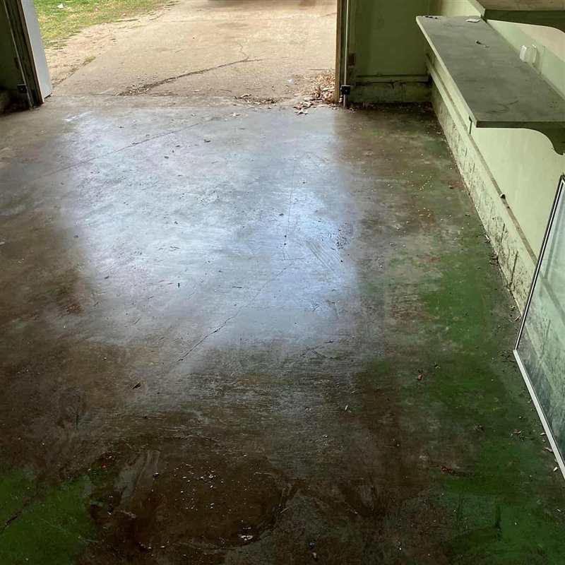 The same garage swept clean and empty after the A Plus Junk Removal cleanout